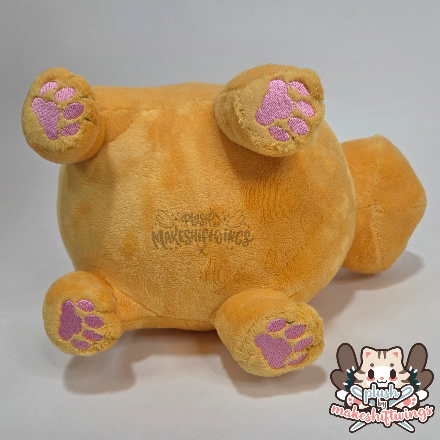 Orange fat cat in a sweater