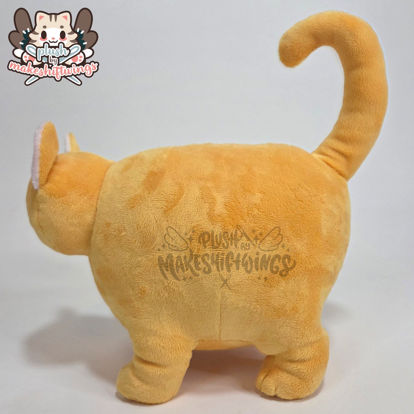 Orange fat cat in a sweater