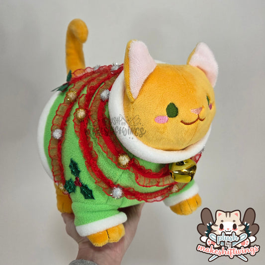 Orange fat cat in a sweater