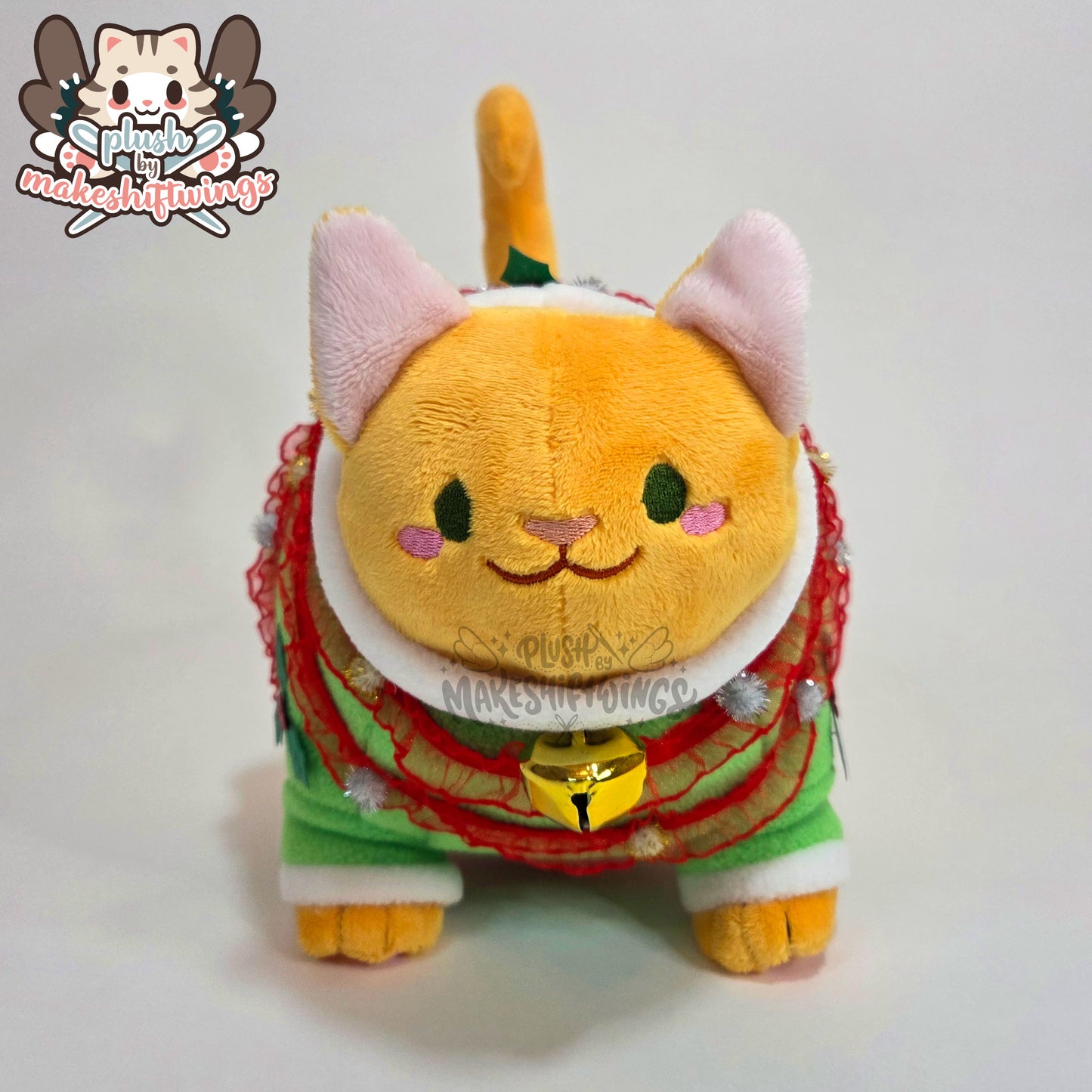 Orange fat cat in a sweater