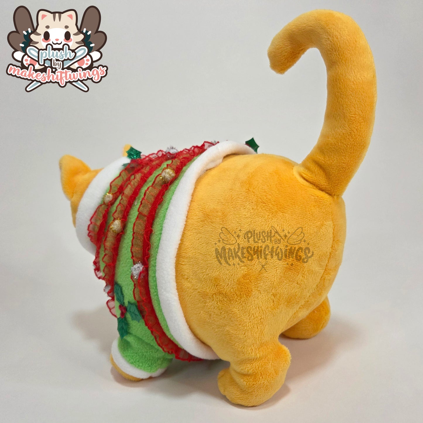 Orange fat cat in a sweater