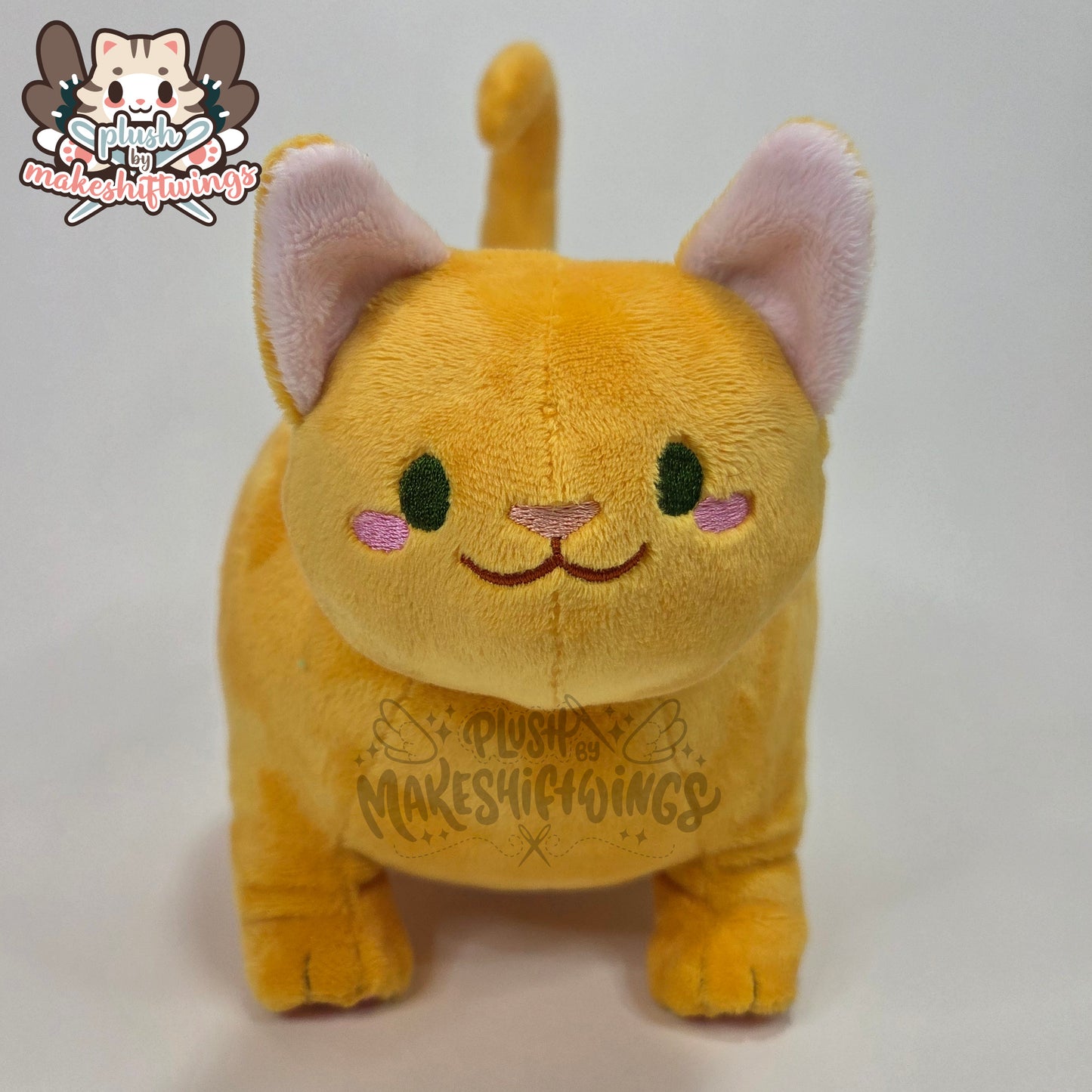 Orange fat cat in a sweater