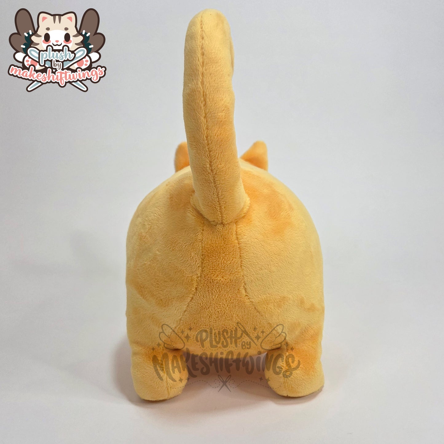 Orange fat cat in a sweater