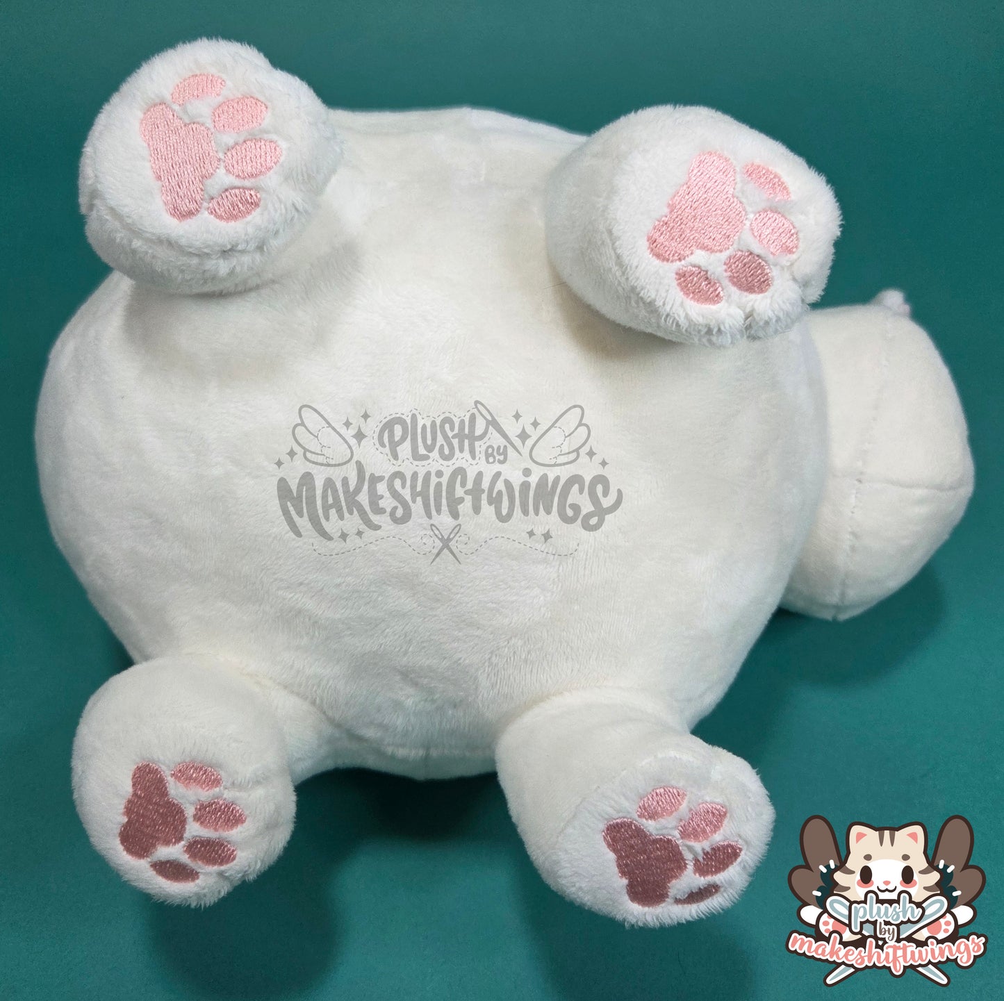 White fat cat in a sweater